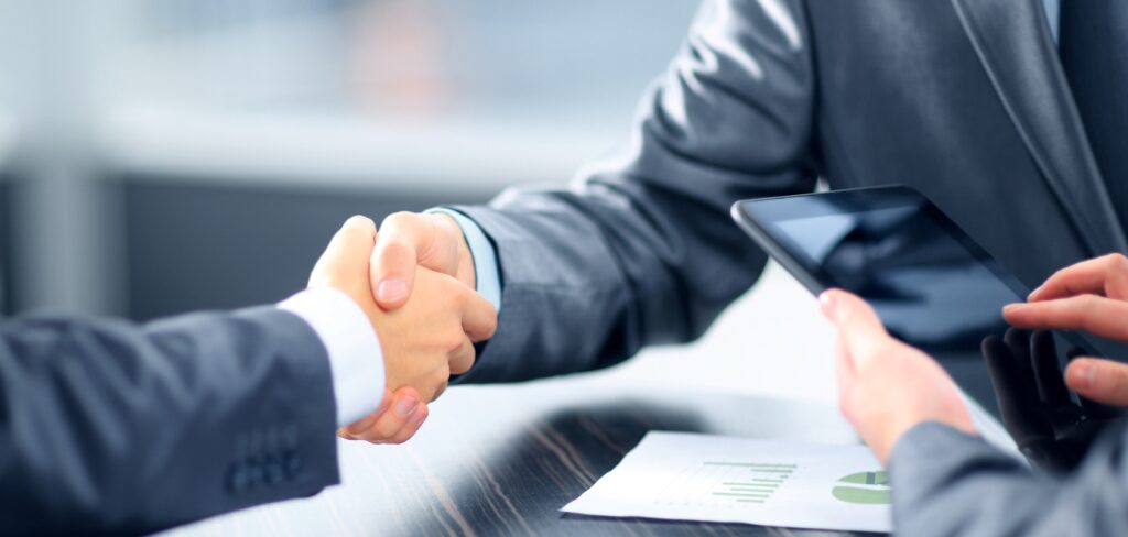 Business people shaking hands in office